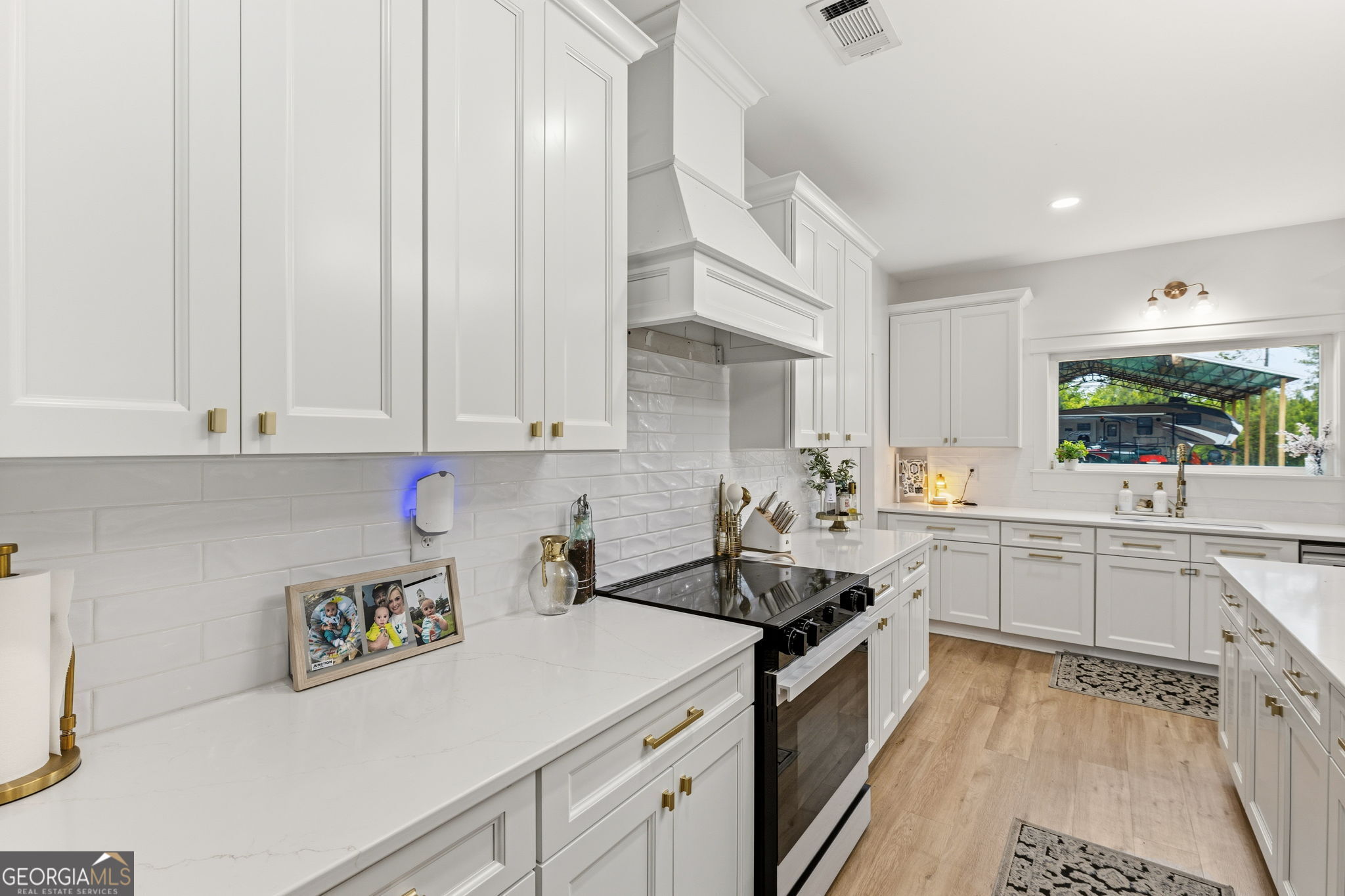 51 Prong Road Swainsboro, GA 30401 - Photo 15 of 55 a kitchen with a sink stove and cabinets