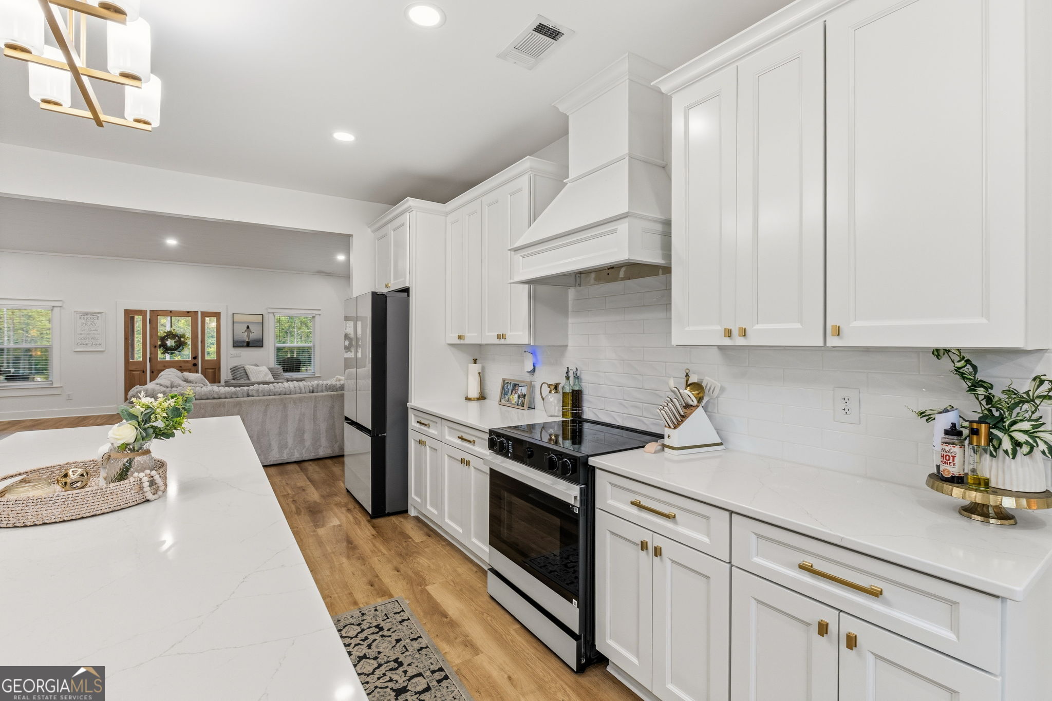 51 Prong Road Swainsboro, GA 30401 - Photo 17 of 55 a kitchen with white cabinets and appliances