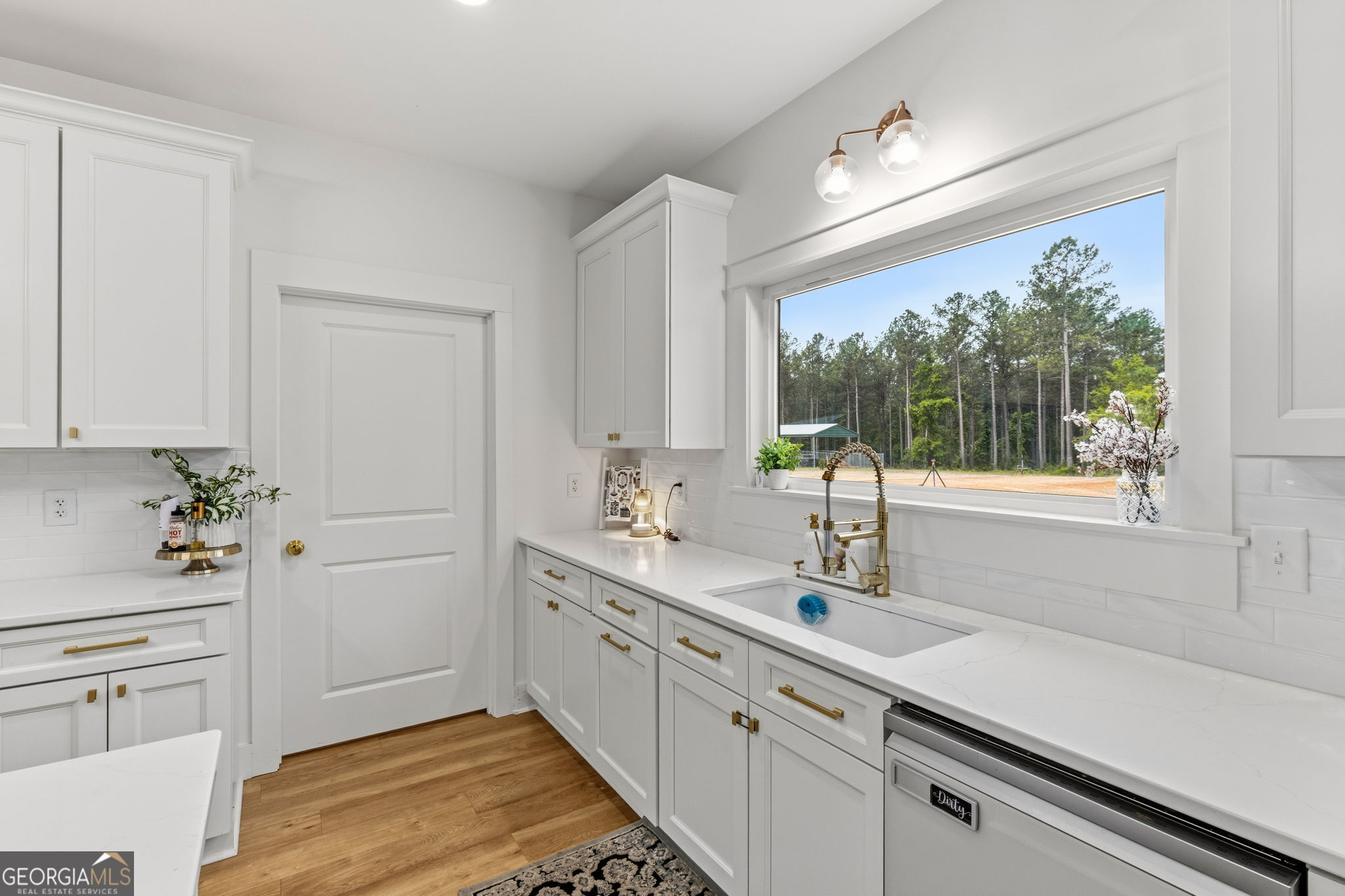 51 Prong Road Swainsboro, GA 30401 - Photo 18 of 55 a kitchen with a sink and cabinets