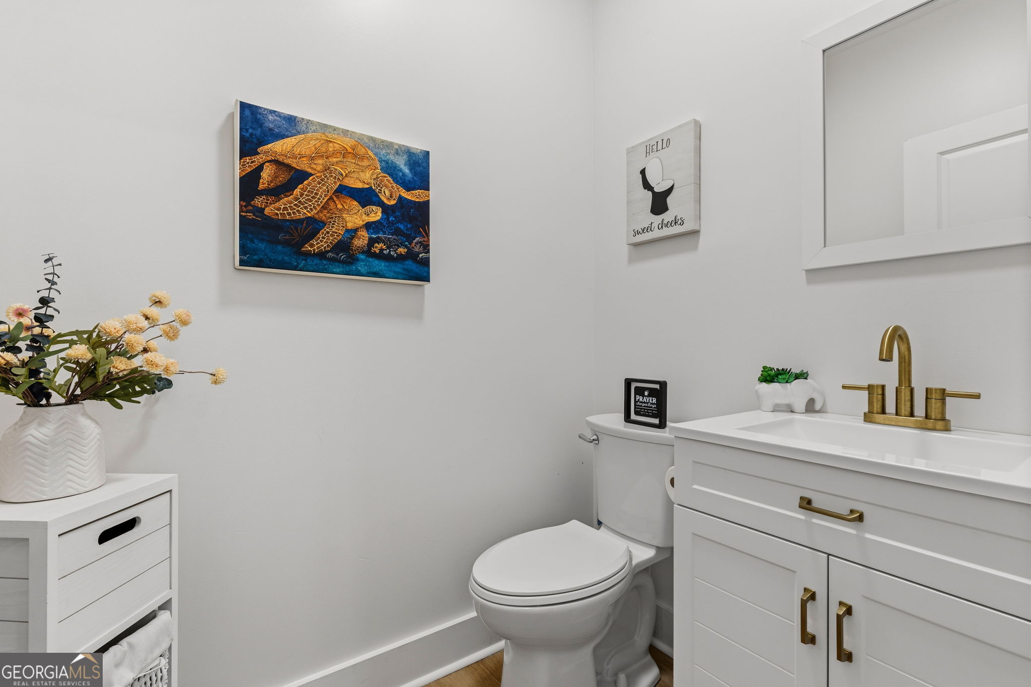 51 Prong Road Swainsboro, GA 30401 - Photo 26 of 55 a bathroom with a toilet a sink and mirror