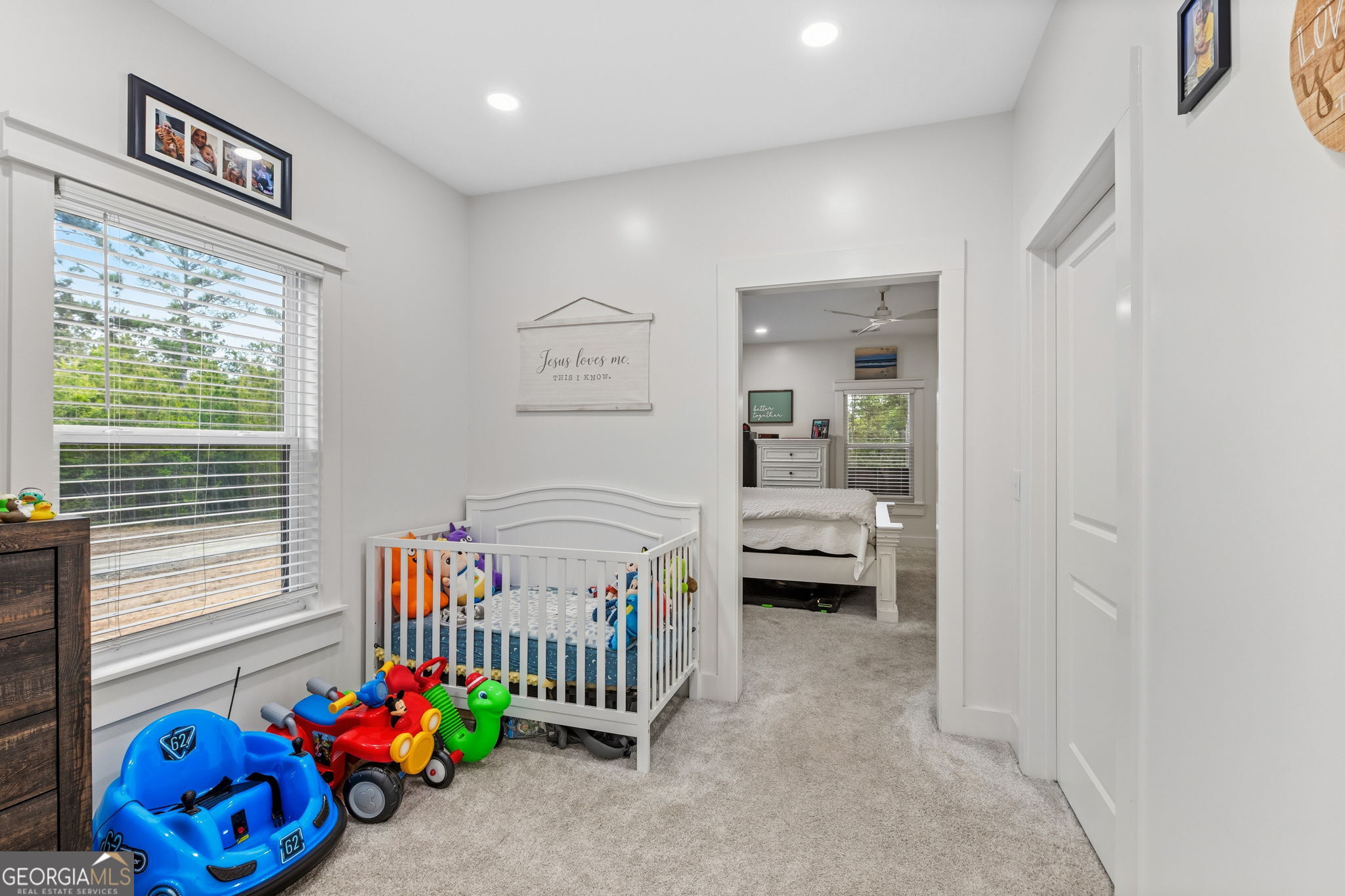 51 Prong Road Swainsboro, GA 30401 - Photo 34 of 55 a livingroom with toys and a baby crib