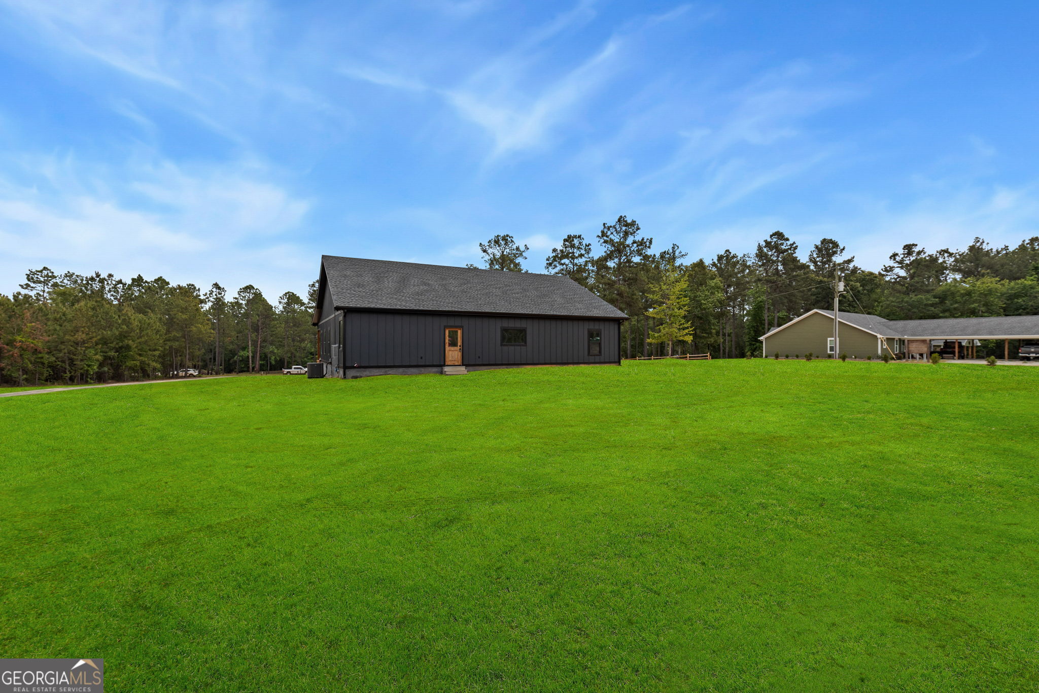 51 Prong Road Swainsboro, GA 30401 - Photo 40 of 55 a backyard of a house with lots of green space and mountain view