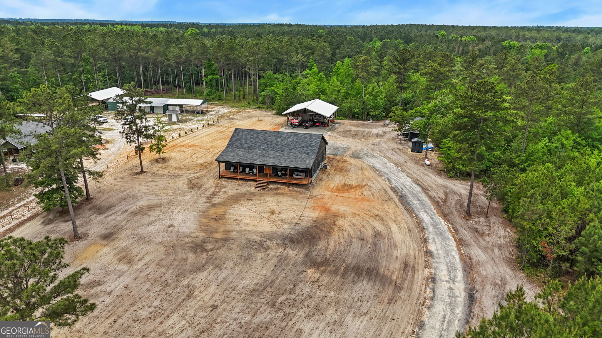 51 Prong Road Swainsboro, GA 30401 - Photo 53 of 55 a view of a backyard with sitting area