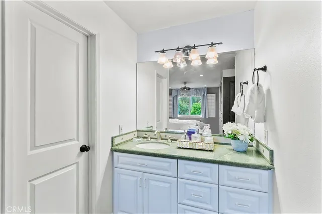 a bathroom with a double vanity sink and a mirror
