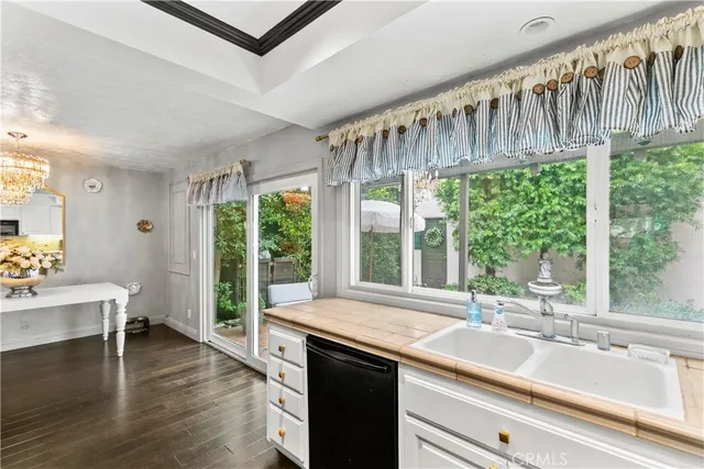 a kitchen with a sink and a large window