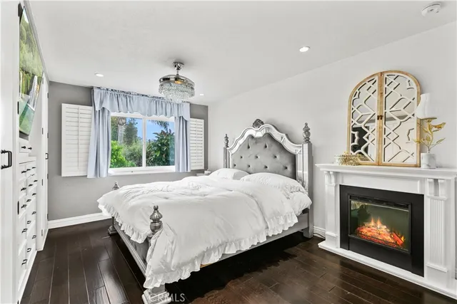 a bed sitting in a bedroom next to a fireplace