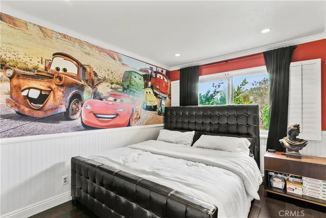 a bedroom with a bed and dresser