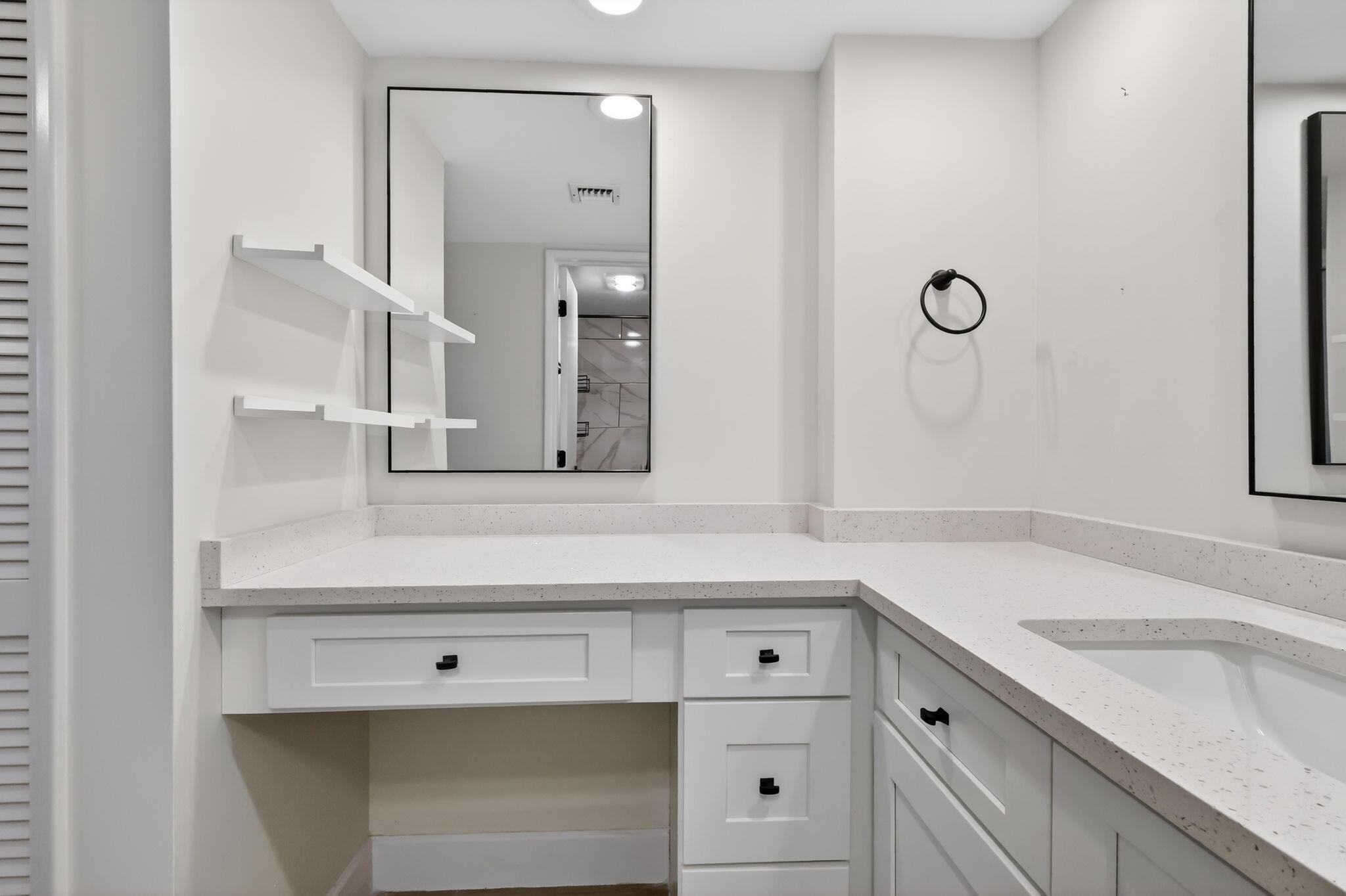545 Oaks Lane, Unit 409 Pompano Beach, FL 33069 - Photo 13 of 25 a bathroom with a sink and a mirror
