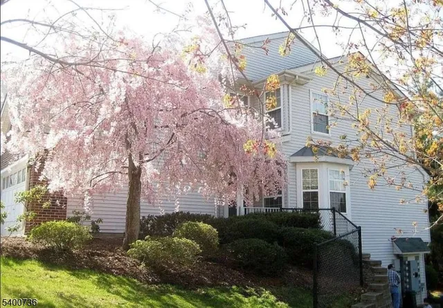 a view of a building with a yard