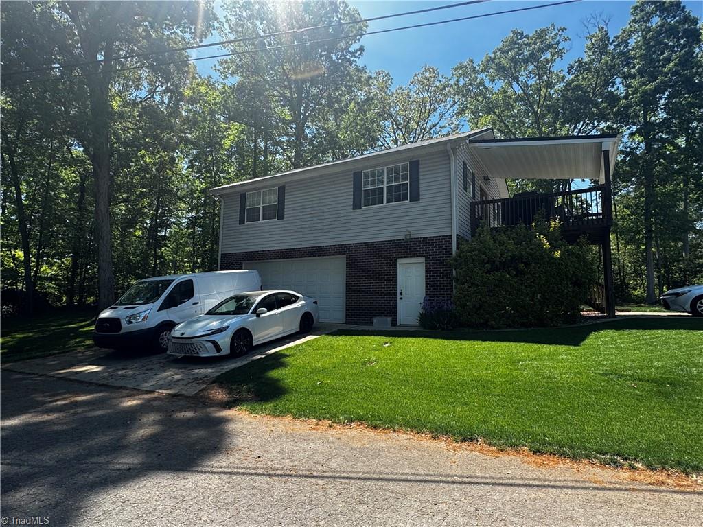 103 Robin Hood Road Lexington, NC 27292 - Photo 2 of 26 Side view with garage and basement access