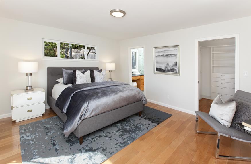 1055 Cascade Drive Menlo Park, CA 94025 - Photo 14 of 24 a bedroom with a bed and a couch