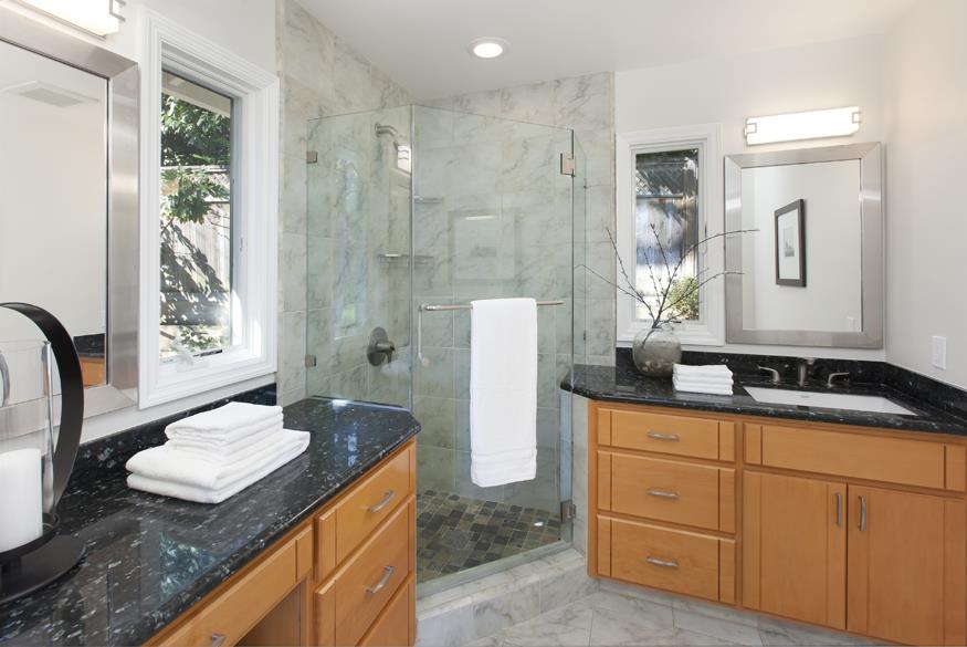 1055 Cascade Drive Menlo Park, CA 94025 - Photo 15 of 24 a bathroom with a granite countertop sink and a mirror