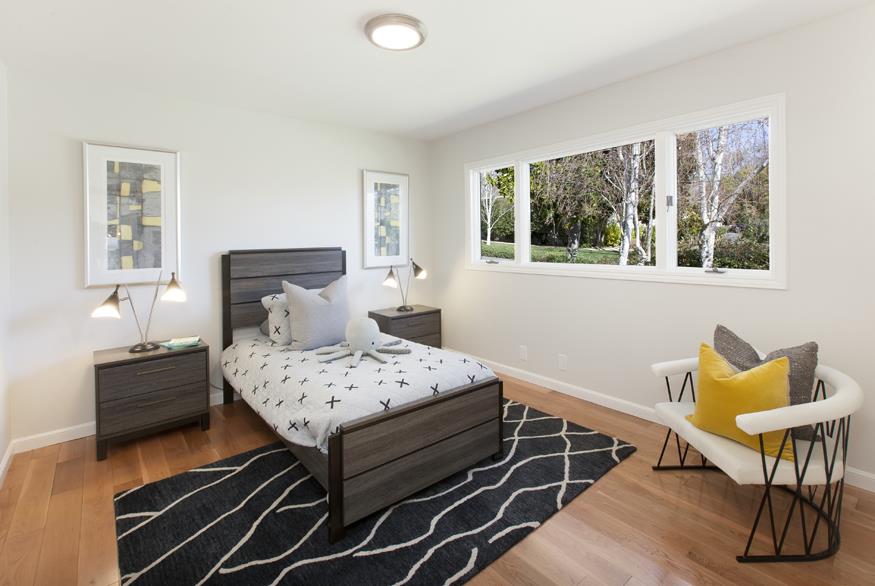 1055 Cascade Drive Menlo Park, CA 94025 - Photo 17 of 24 a bedroom with a bed and a window