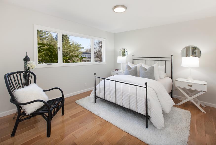 1055 Cascade Drive Menlo Park, CA 94025 - Photo 19 of 24 a bedroom with a bed and a window