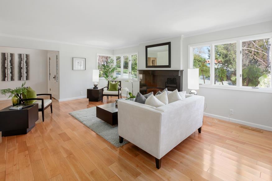 1055 Cascade Drive Menlo Park, CA 94025 - Photo 3 of 24 a living room with furniture and a fireplace