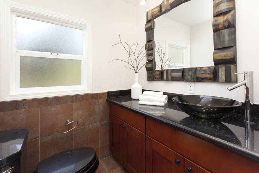 1055 Cascade Drive Menlo Park, CA 94025 - Photo 6 of 24 a kitchen with a sink and cabinets
