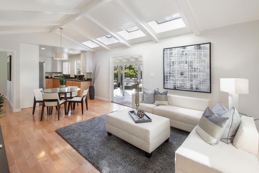 1055 Cascade Drive Menlo Park, CA 94025 - Photo 9 of 24 a living room with furniture and a large window