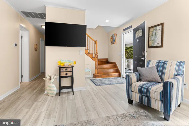 a kitchen with a refrigerator sink and cabinets