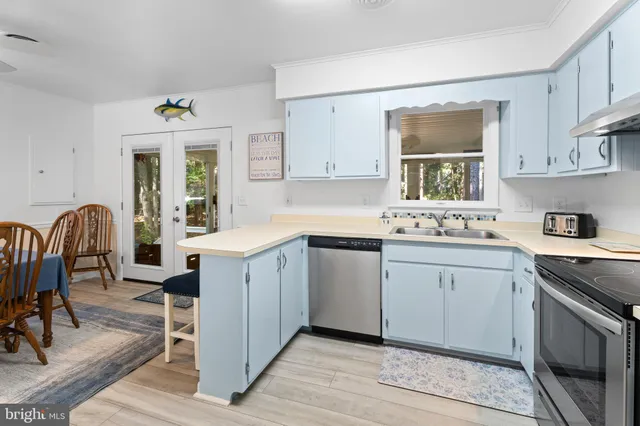 a bedroom with a bed a window and dresser