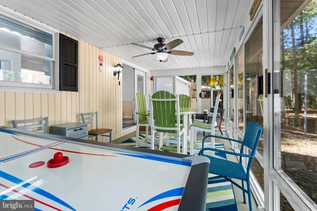 a spacious bedroom with a bed and a painting on the wall