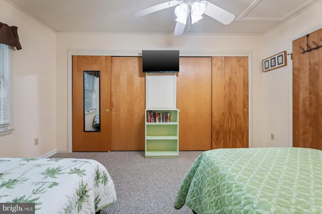 an aerial view of a house with a lake view
