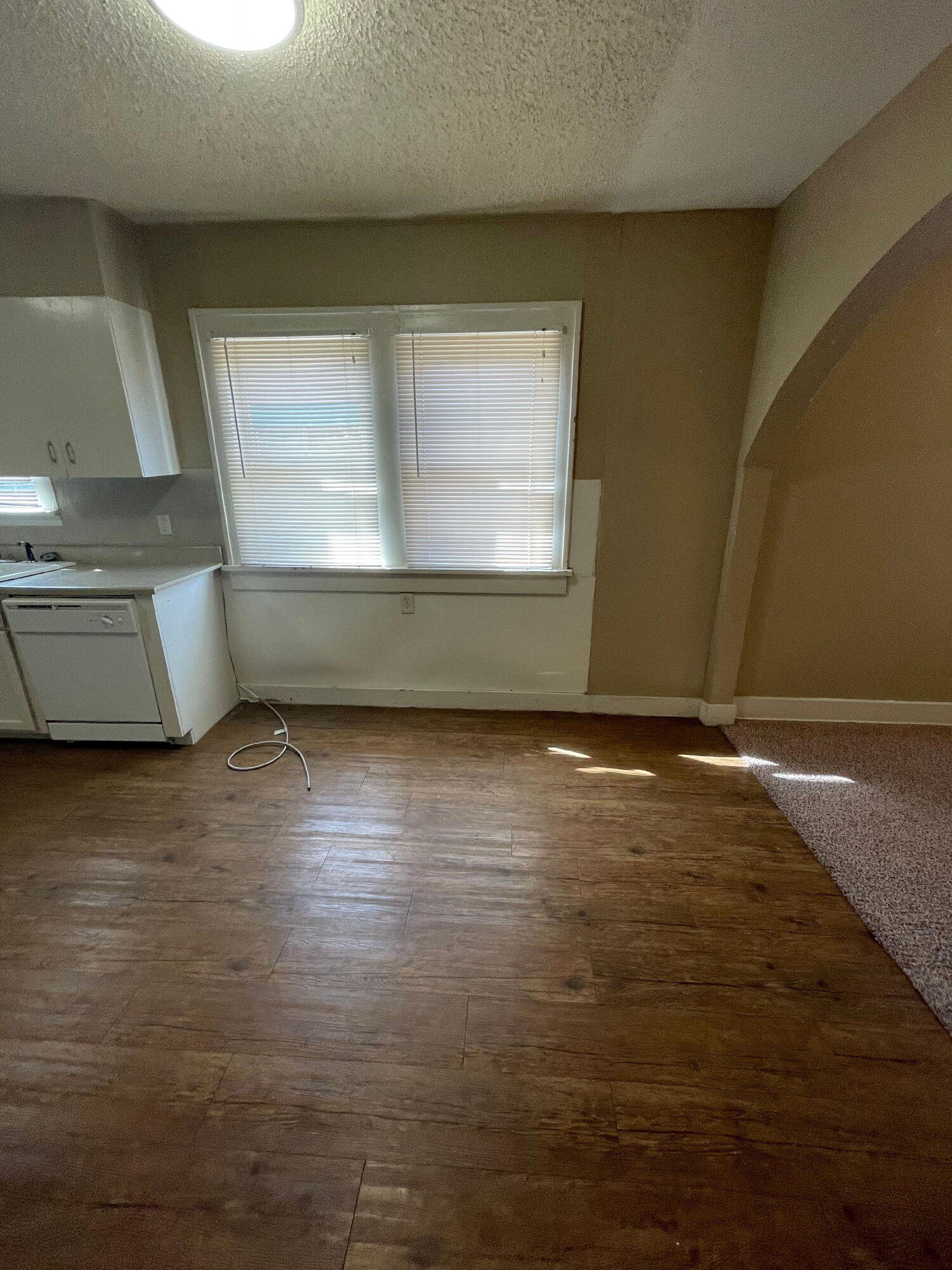 2111 14th Street Lubbock, TX 79401 - Photo 4 of 10 a view of room with window and wooden floor