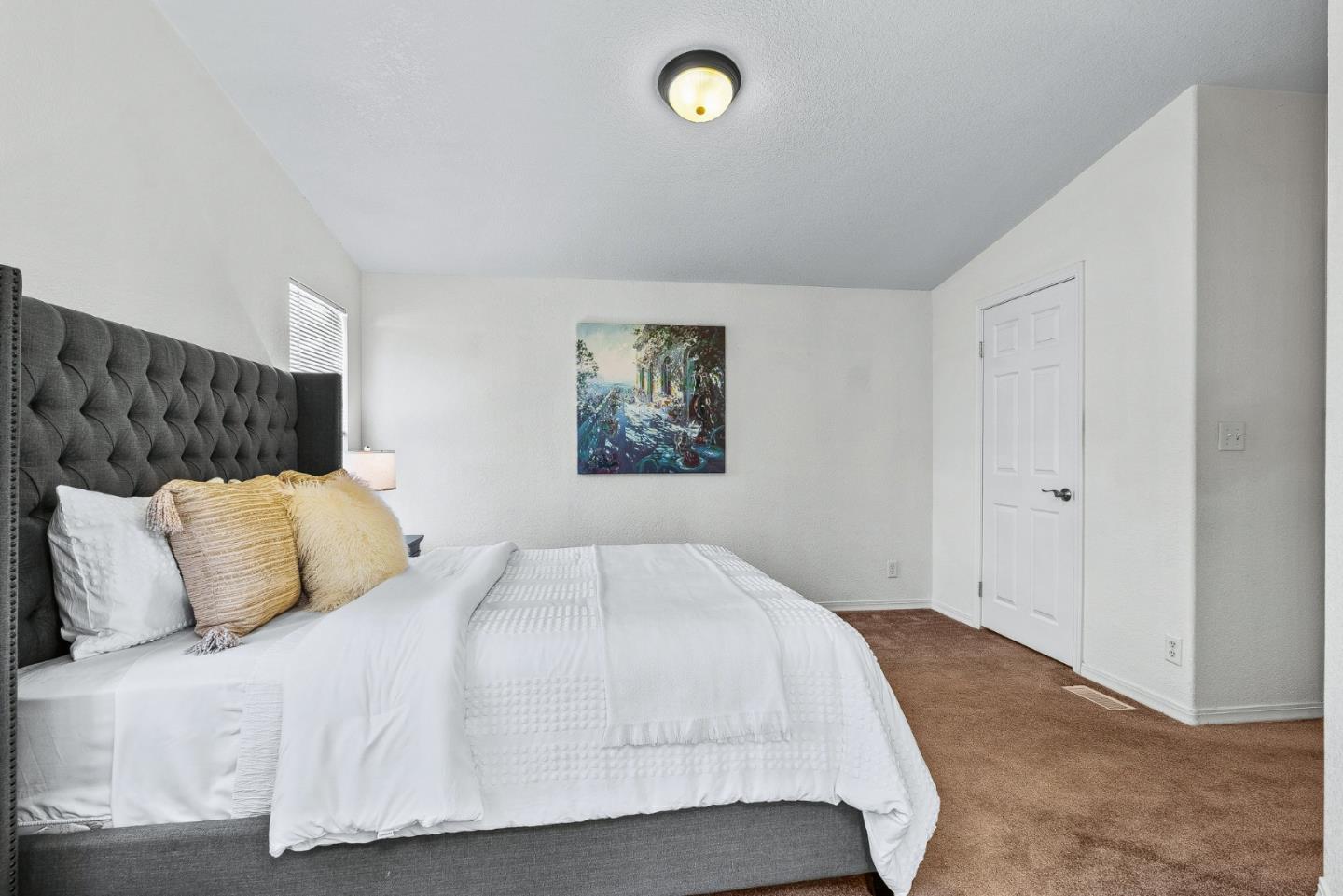 100 North Rodeo Gulch Road, Unit 74 Soquel, CA 95073 - Photo 16 of 40 a bedroom with a bed and a night stand