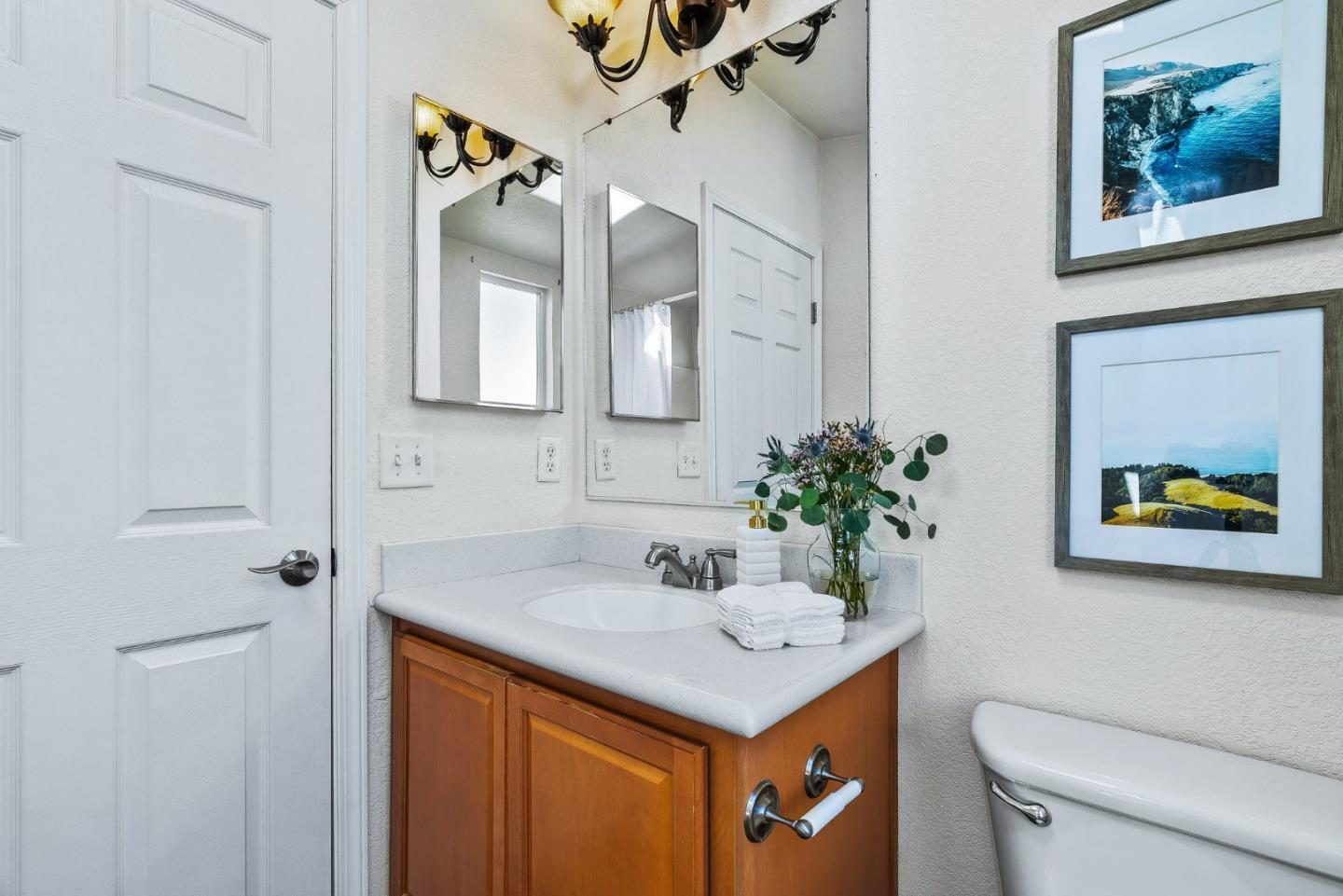 100 North Rodeo Gulch Road, Unit 74 Soquel, CA 95073 - Photo 19 of 40 a bathroom with a sink a toilet and a mirror