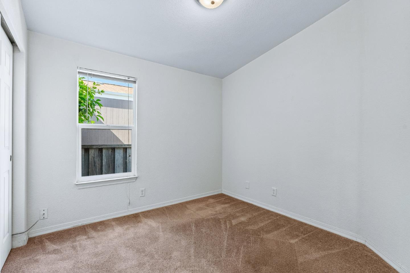 100 North Rodeo Gulch Road, Unit 74 Soquel, CA 95073 - Photo 23 of 40 an empty room with a window