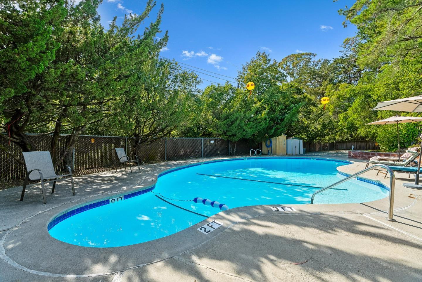 100 North Rodeo Gulch Road, Unit 74 Soquel, CA 95073 - Photo 28 of 40 a view of a swimming pool with a patio and a yard