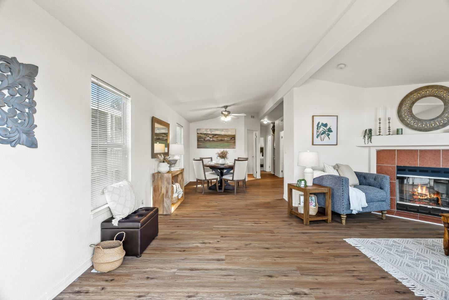 100 North Rodeo Gulch Road, Unit 74 Soquel, CA 95073 - Photo 10 of 40 a living room with fireplace furniture and a dining table with wooden floor