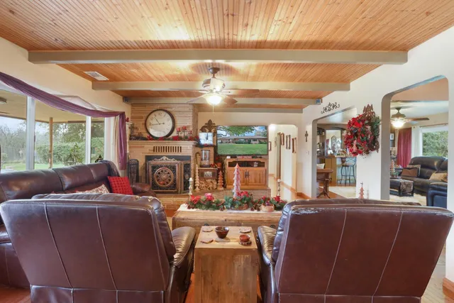 a kitchen with stainless steel appliances granite countertop a refrigerator a stove and a sink with dishwasher