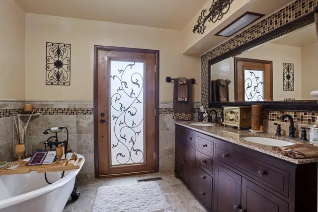 a bedroom with two beds and a large window