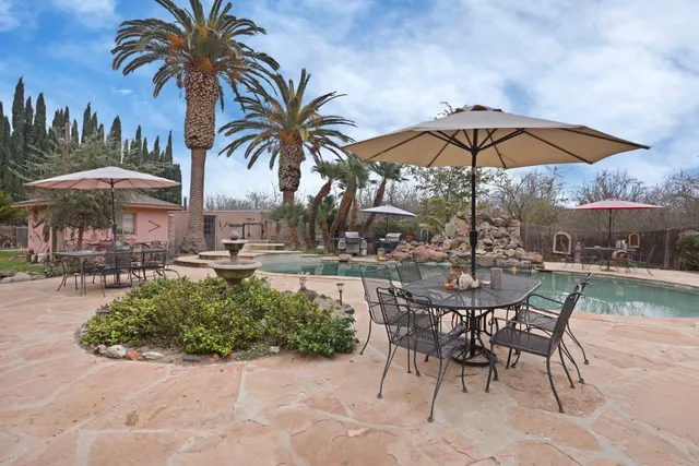 an aerial view of a house with garden space and street view