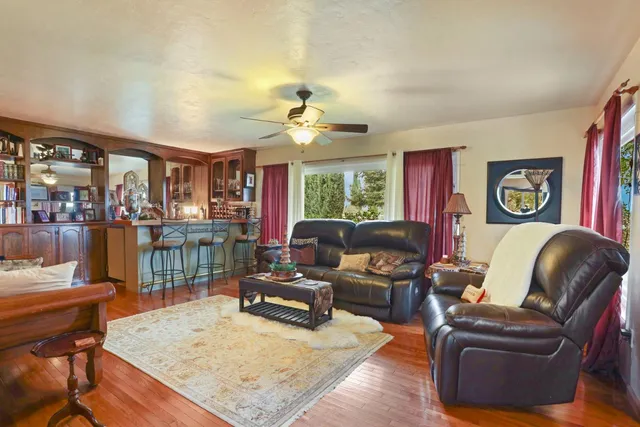 a living room with furniture or couch and a chandelier