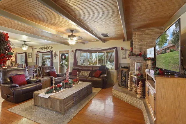 a kitchen with stainless steel appliances granite countertop a stove top oven a sink a counter space and cabinets