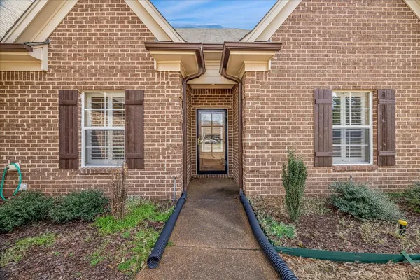 a large kitchen with stainless steel appliances granite countertop a stove and a sink