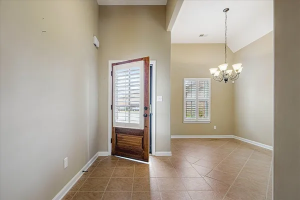 a large kitchen with stainless steel appliances granite countertop a stove and cabinets