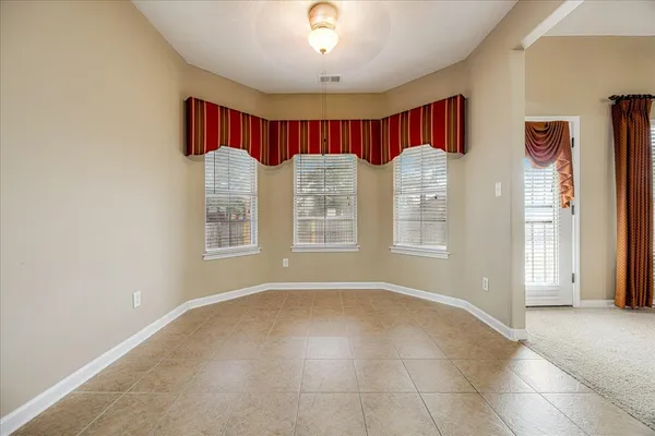 a spacious bathroom with a double vanity sink mirror and shower