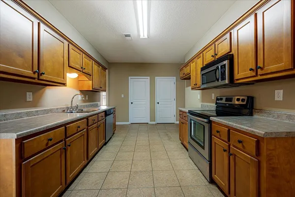 a view of a livingroom with a fireplace and a window