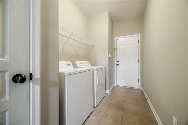 a view of a big room with closet and chandelier fan