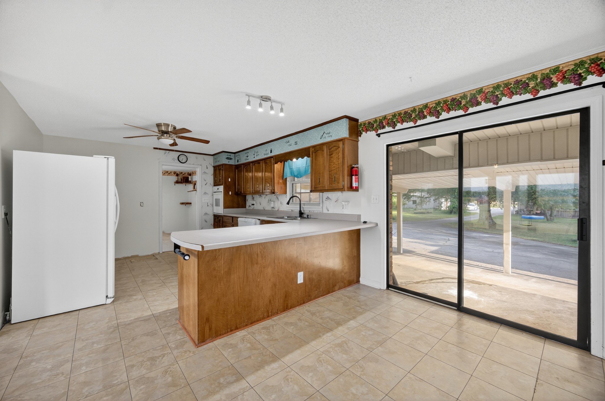 509 Limestone Road Elora, TN 37328 - Photo 11 of 41 a view of a kitchen with kitchen island a counter top and a stove