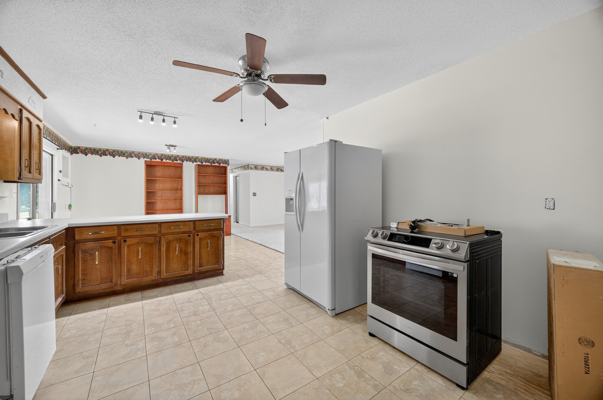 509 Limestone Road Elora, TN 37328 - Photo 14 of 41 a kitchen with stainless steel appliances a stove a refrigerator and a sink