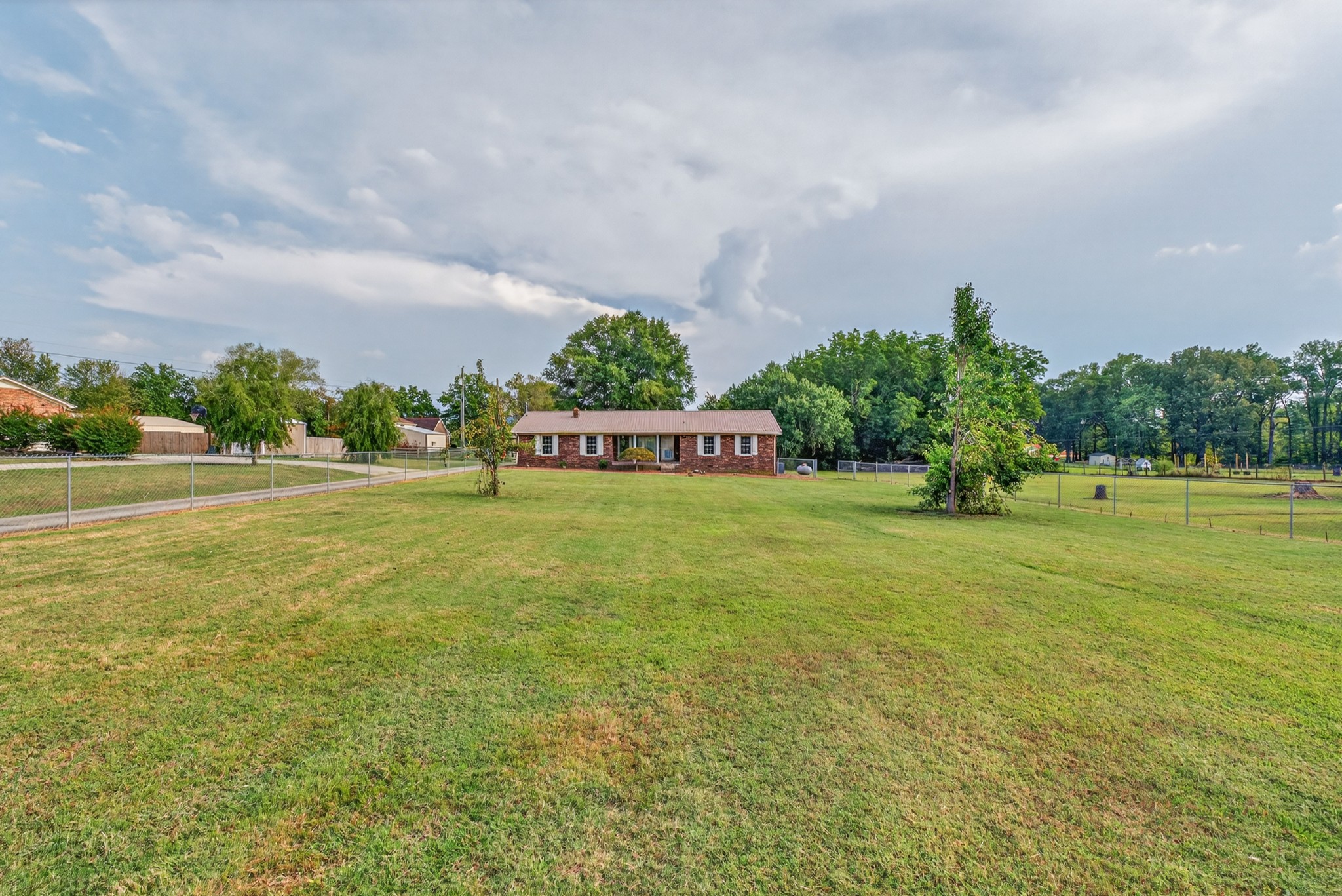 509 Limestone Road Elora, TN 37328 - Photo 2 of 41 a view of a garden with a building in the background