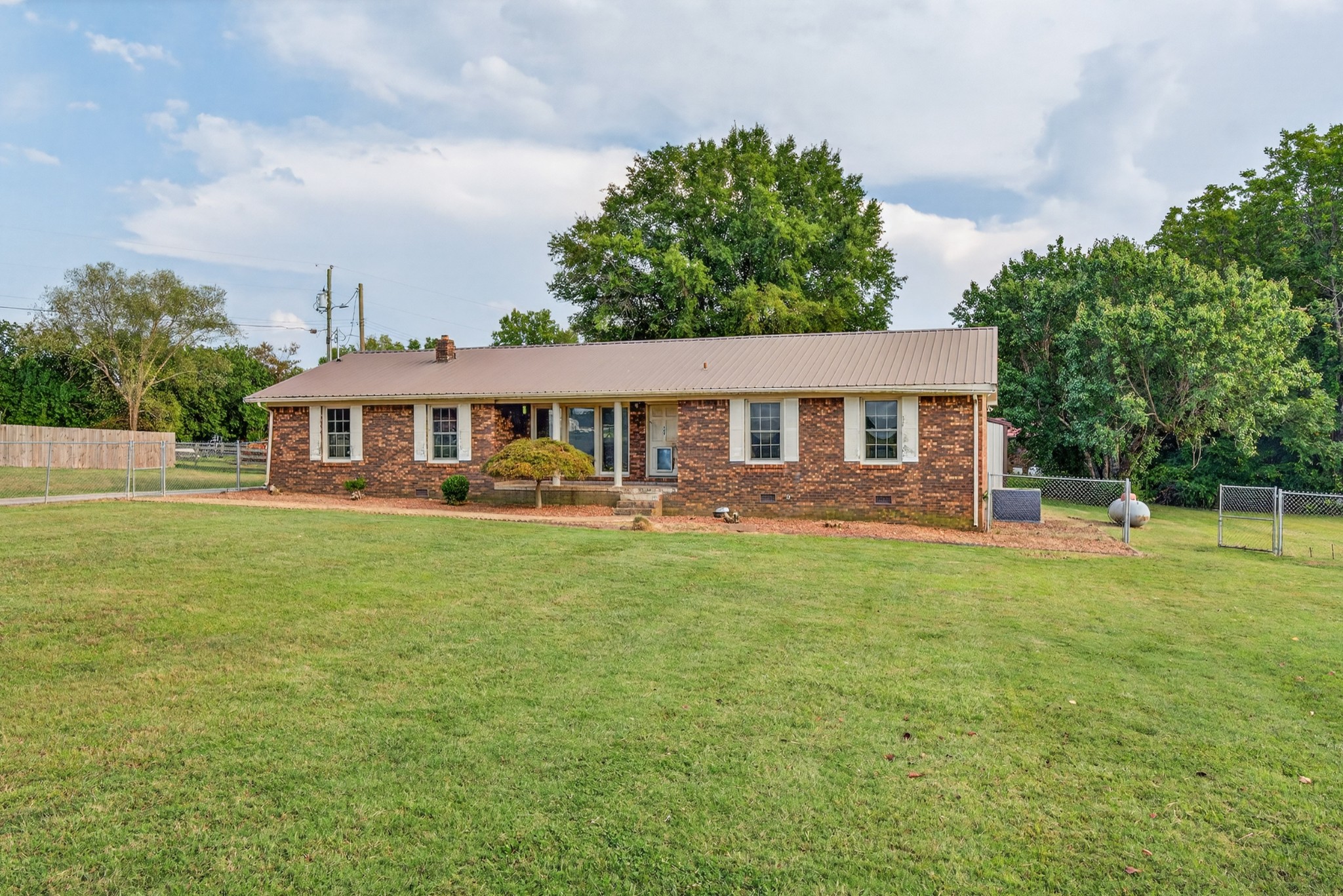509 Limestone Road Elora, TN 37328 - Photo 3 of 41 a front view of a house with a yard table and chairs