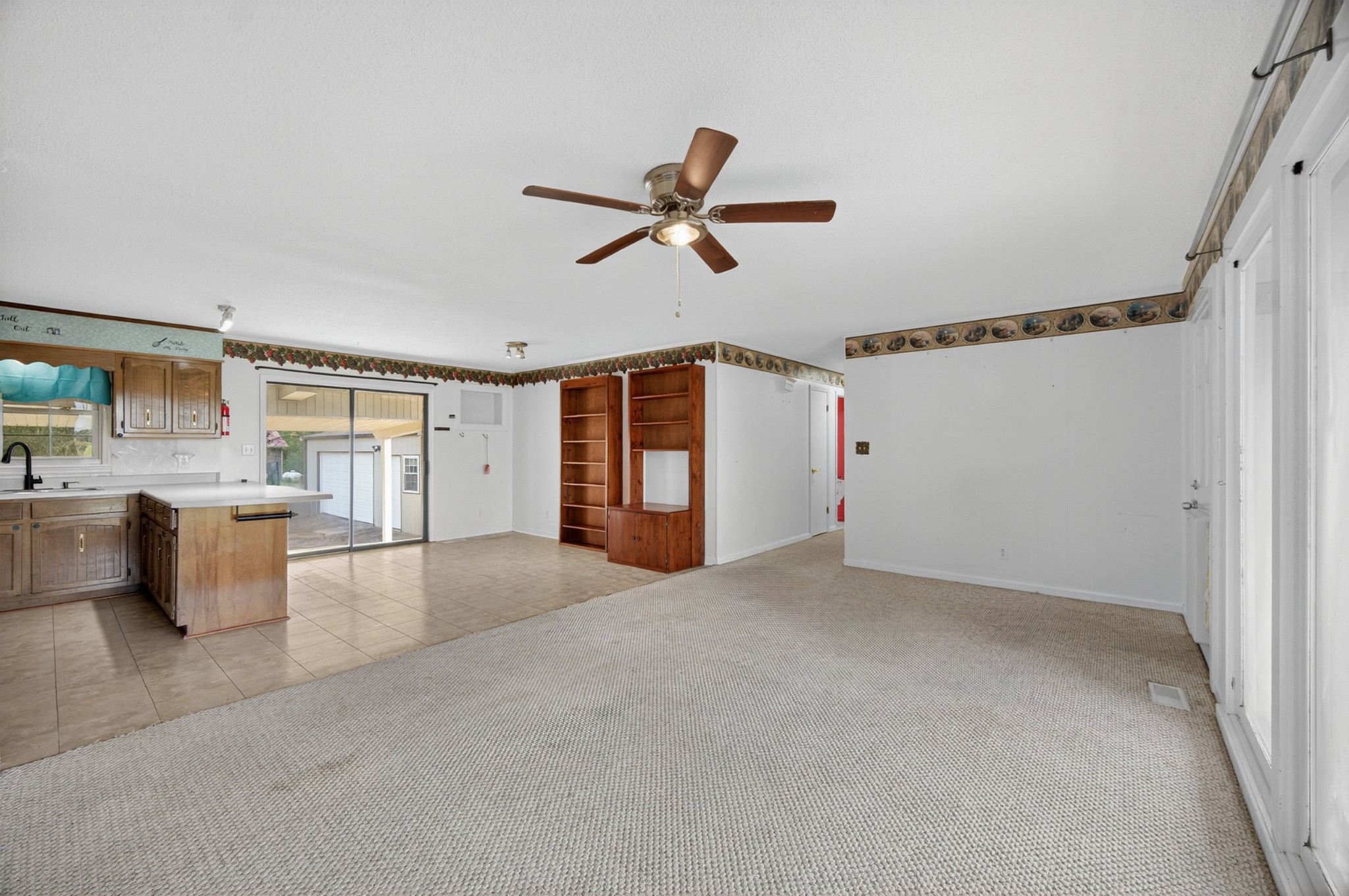 509 Limestone Road Elora, TN 37328 - Photo 9 of 41 a view of a livingroom with furniture and ceiling fan