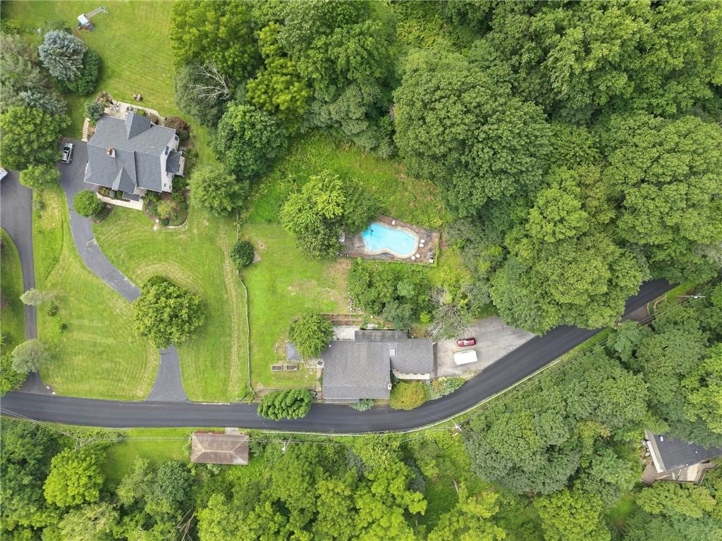 3408 Oak Hill Road Emmaus, PA 18049 - Photo 60 of 93 Lush mature trees surround a private swimming pool nestled in a spacious green yard.