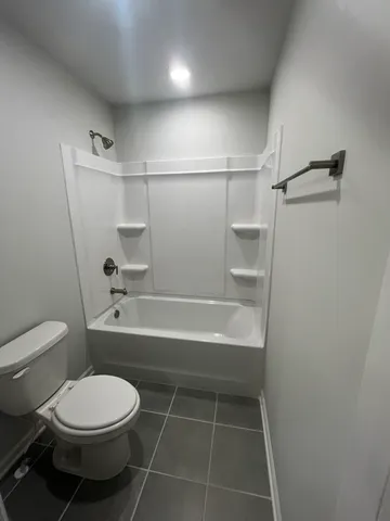 a bathroom with a double vanity sink a mirror and a shower