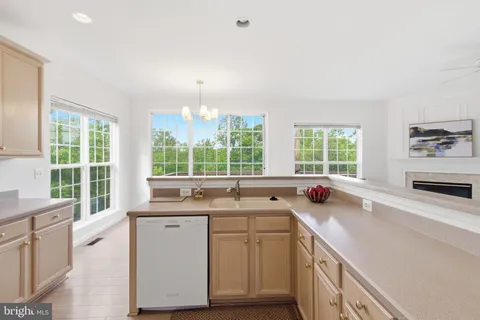 a bathroom with a granite countertop tub a sink and a large mirror