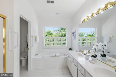 an empty room with closet and a bathroom